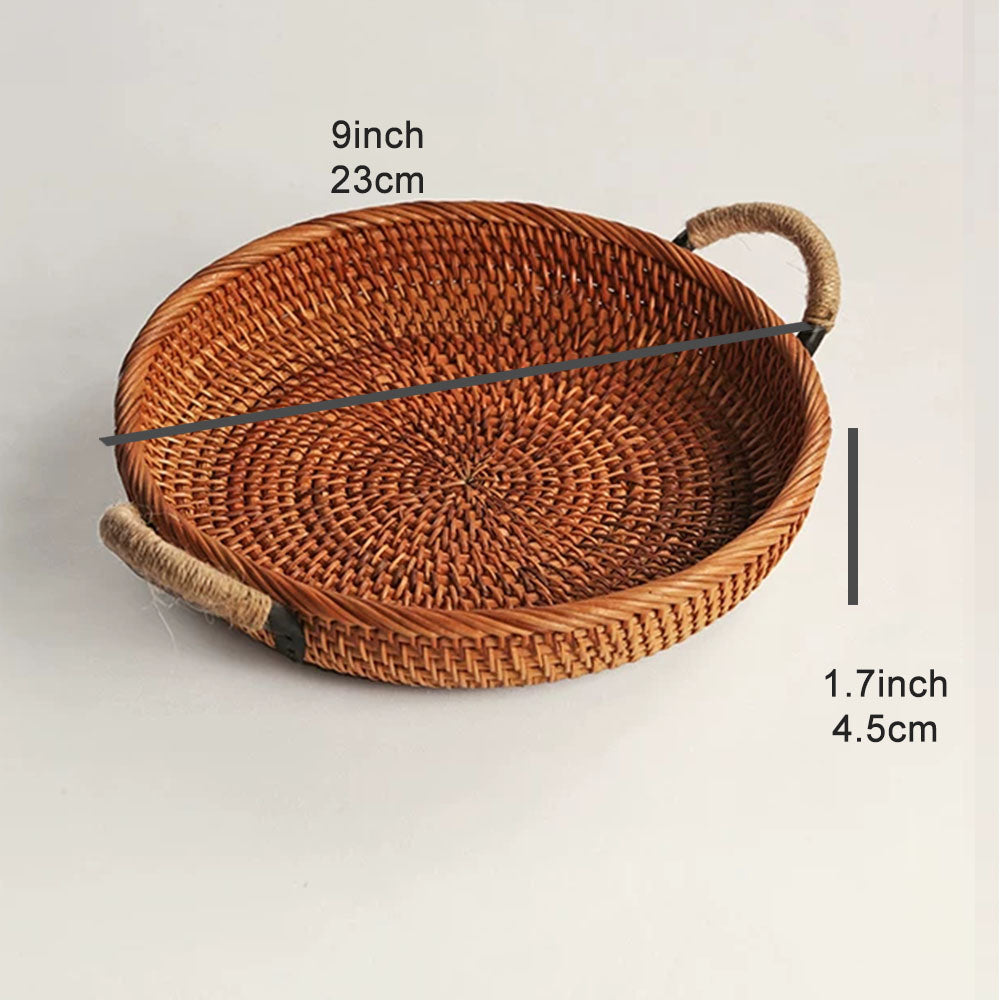 A round woven rattan tray with two rope handles, dimension labels indicating 9 inch (23 cm) diameter and 1.7 inch 