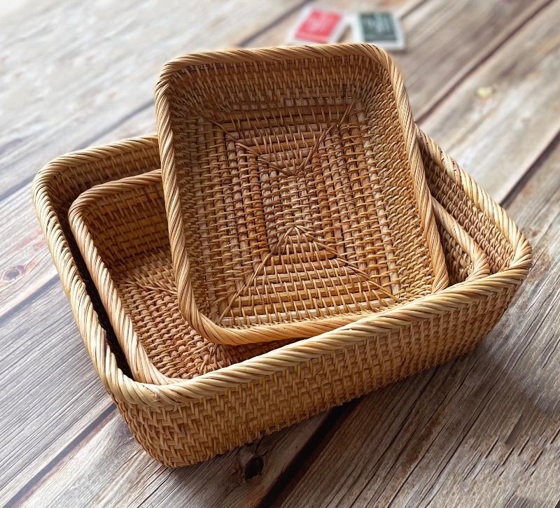 This set of three rectangular rattan baskets is designed for everyday small-item organization across multiple rooms. 