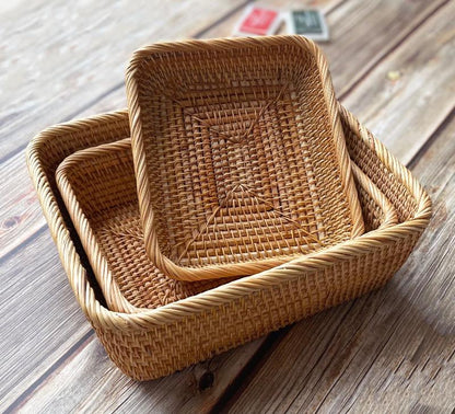 This set of three rectangular rattan baskets is designed for everyday small-item organization across multiple rooms. 